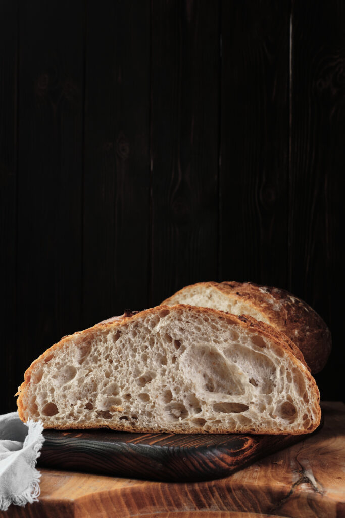 High hydration dough bread showing open crumb structure with large air pockets and artisan crust